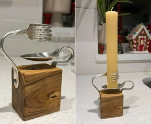 un bougeoir avec une fourchette et une cuillère